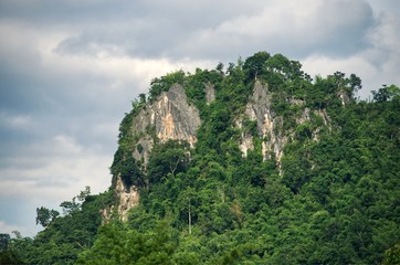 Fototapeta na wymiar Cliff mountain stone with cloud sky background : Thailand