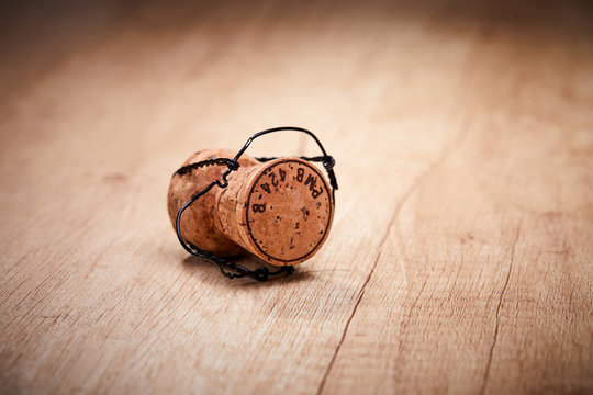 Champagne cork with text on cap