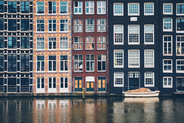 Amsterdam canal Damrak with houses, Netherlands