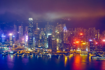 Aerial view of illuminated Hong Kong skyline. Hong Kong, China