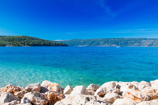 Fototapeta Croatia, Cres island, yacht boat sailing in blue lagoon, seascape, sunny summer day