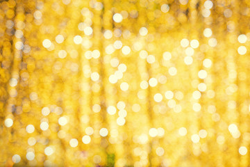 Golden bokeh, blurred abstract background with garlands at the festival