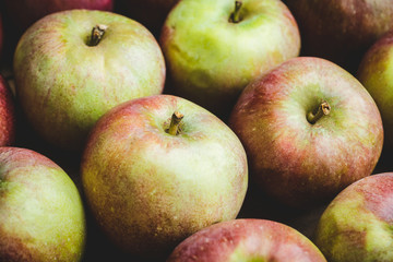 Fresh ripe apples on the wooden background. Selective focus. Shallow depth of field.