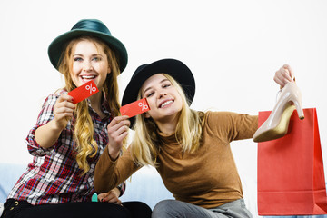 Two woman after sale shopping