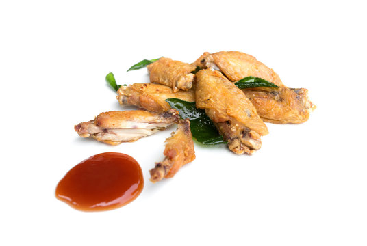 Fried chicken wings and ketchup isolated on white background
