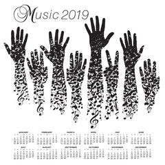 A creative 2019 musical calendar made with hands and notes   