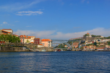Fototapeta na wymiar City view from the river Douro. Porto, Portugal. Dom Luís I Bridge.