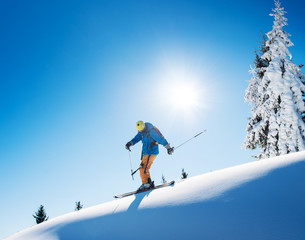 Full length shot of a professional freeride skier skiing on top of the mountain copyspace active people living leisure hobby extreme slope snow winter seasonal sport. - obrazy, fototapety, plakaty