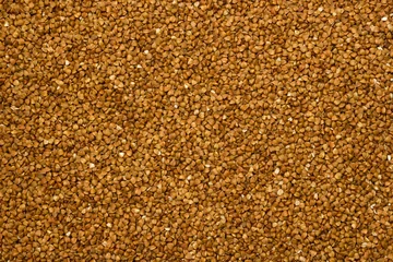 Poster Dry buckwheat grains - brown texture © alexey_m
