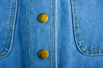 Blue washed faded jeans texture with seams, clasps, buttons and rivets