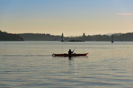 Kayaker is enjoying a wonderful sunny day. Kayaker on the Scenic Sea Panoramic Photo. Kayak Water Sports Banner with Copy Space. Oslo, Norway