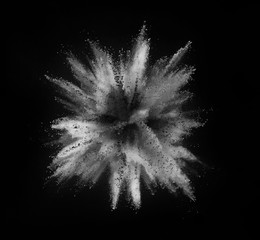 White powder explosion on black background