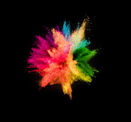 Colored powder explosion on black background