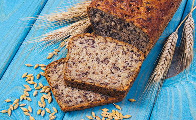 Multi-grain bread on a wooden background. Healthy food concept.