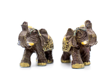 Figurines of indian elephants on a white background