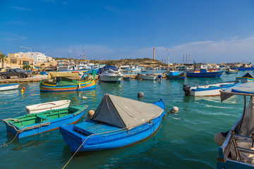 Fototapeta na wymiar Marsaxlokk, Malta. Boats in the harbor