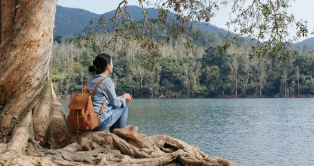 Woman look at the lake in countryside