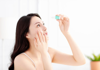 Beautiful Woman Applying Eyedrops In Her Eyes