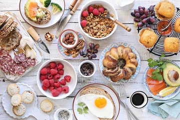 Fototapeta na wymiar Brunch. Family breakfast or brunch set served on rustic wooden table. Overhead view, copy space