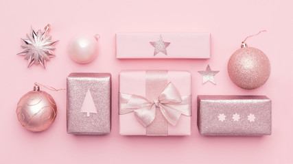Pastel pink minimal christmas banner. Beautiful nordic christmas gifts isolated on pastel pink...