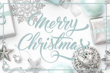 Silver and pastel blue christmas gifts, ornaments and decorations isolated on white background....