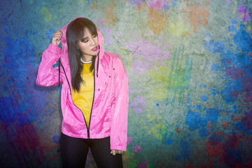 Asian woman dressed in a pink jacket