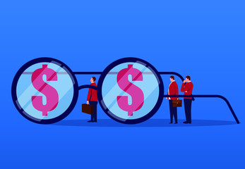 Businessman studies finance through glasses