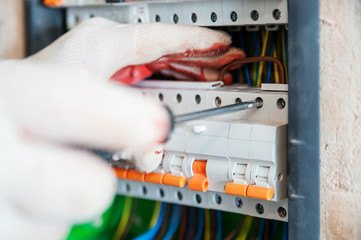 A electrician is installing the fuses.