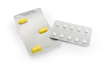Blister packs with different pills on a white background