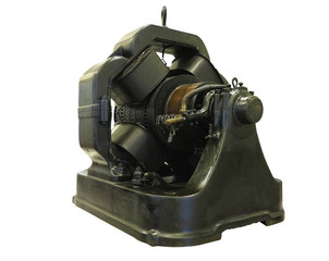 Vintage old industrial equipment powerful electric motor isolated over white