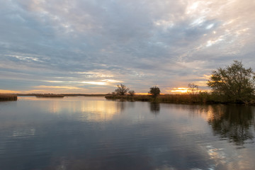 Sunrise over tranquil water