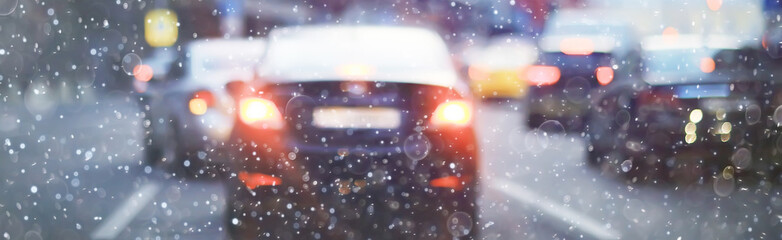 blurred transport background snow / traffic on a winter highway, seasonal auto concept, blurry auto...