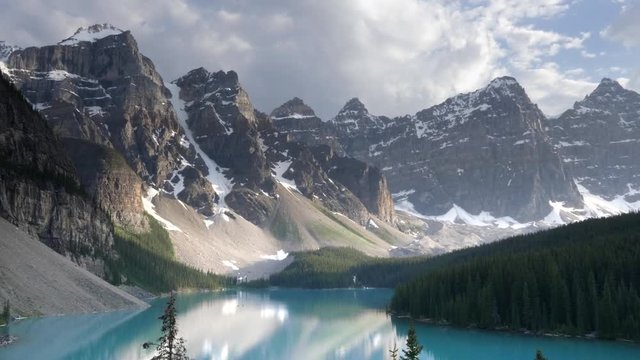 a close up of mountains behind moraine lake at banff national park in canada