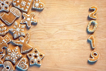 Merry Christmas and Happy new year! Homemade ginger cookies on wooden table. Copy space for your text. Top view. Christmas baking concept