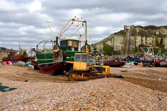 Tractor moving shingle for fishing boat to go to sea