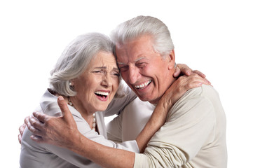 Portrait of happy senior couple on white background