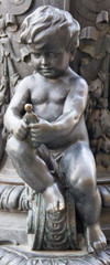 Fototapeta na wymiar beautiful bronze angel sitting