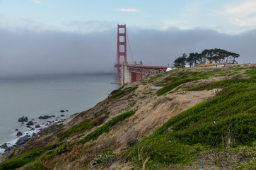 Fototapeta na wymiar thick fog covering Golden Gate Bridge San Francisco, California, USA