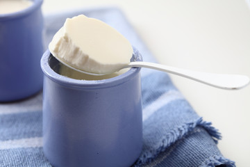 Fototapeta na wymiar Yogurt in blue jars