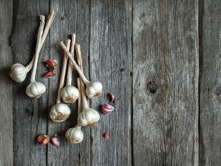 Bunch of garlic heads shot from above on wooden background