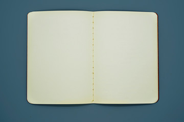 Open Blank Page notebook and dark blue background