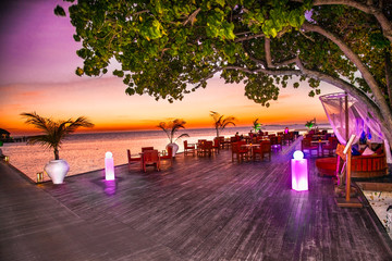  Luxury resort  in sunset on Olhuveli island , Maldives.