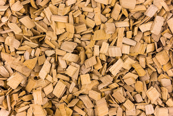 wooden chips ground for smoking smoke gives fragrance a lot of pieces light beige background natural rustic base