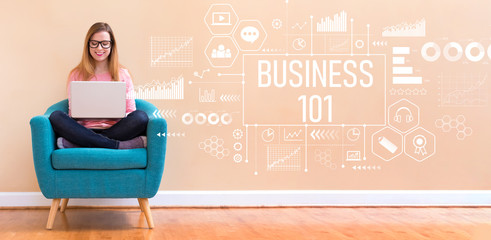Business 101 with young woman using her laptop in a chair