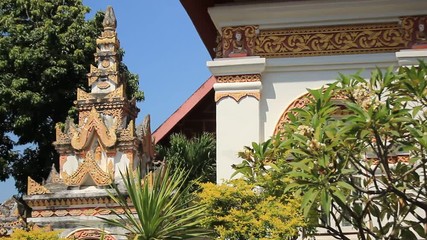 vertical panning shot of Thai Buddhist temple religious building in an old Wat in Chiang Mai, Northern Thailand, Southeast Asia - Powered by Adobe