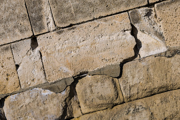 Fototapeta premium base stone oblique large rectangular cobblestone close-up light gray background design wall fort