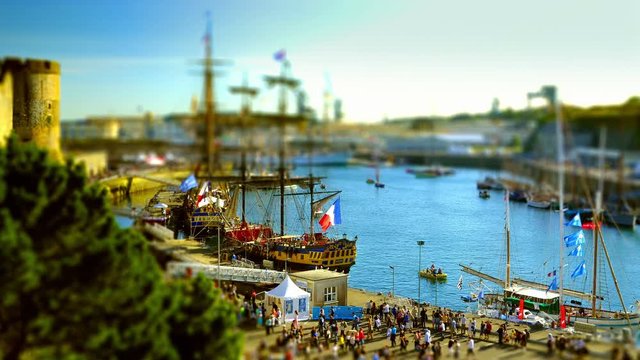 Brest, France - July 14, 2016: Old rigging under the castle in the harbor of Brest with Etoile du Roy and Hermione, the lafayette's ship  - Tilt shift on the Brest's International Maritime Festival.