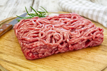raw minced meat on wooden board
