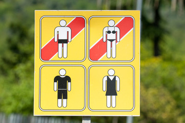 No swimsuit sign. get dressed before leaving the beach in the city