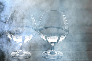 glass of water with ice in the restaurant / cold clear clear water in a glass with ice pieces